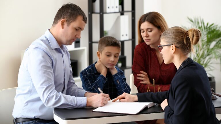 Divorced parents with their son visiting lawyer