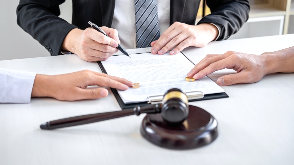 husband and wife during divorce process with male lawyer
